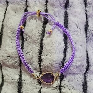Purple Braided Bracelet with Gold Accents And Amethyst Stone.